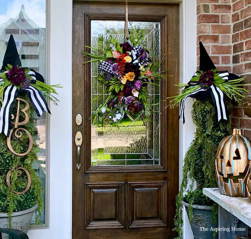 Halloween Porch with door swag and witch's hat topiary