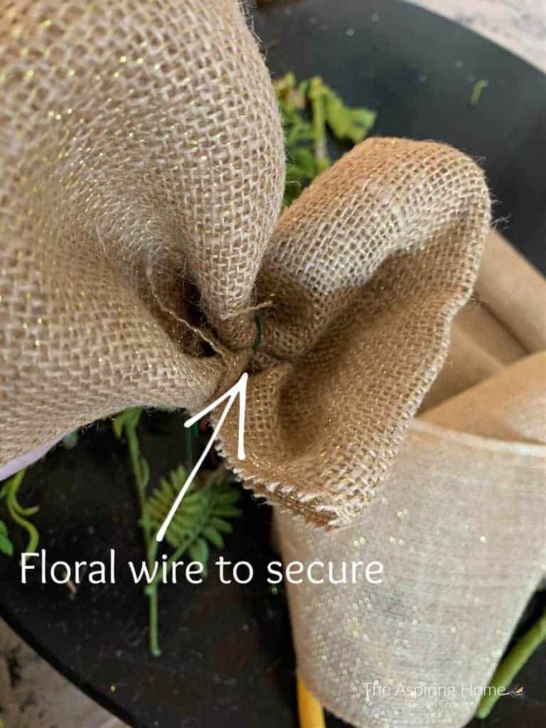 secure the burlap ribbon loop with floral wire