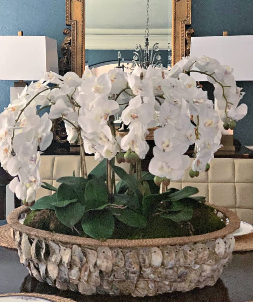 Spring DIY projects with orchid arrangement in oyster basket the aspiring home 