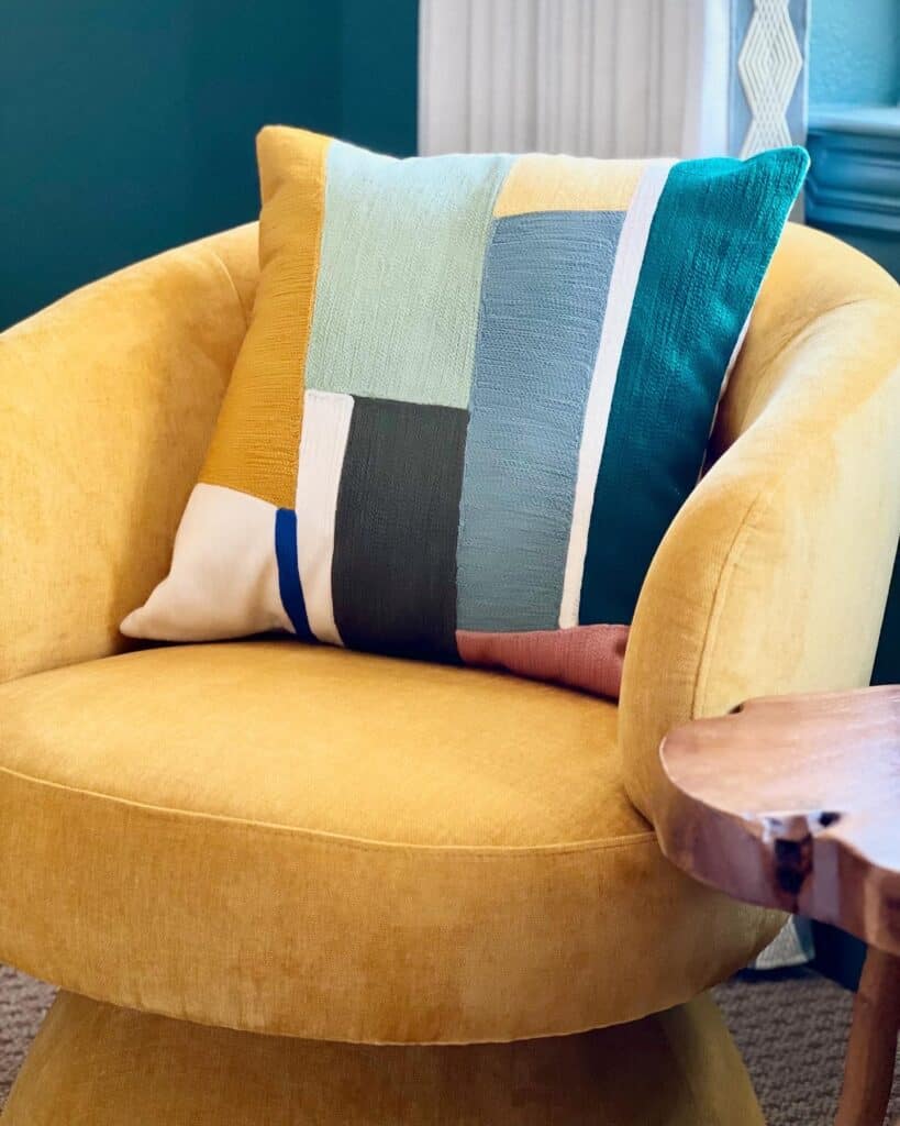 bright mustard yellow chair is a great way to bring in personality without permanence. Guaranteeing that you're not just designing for resale.
