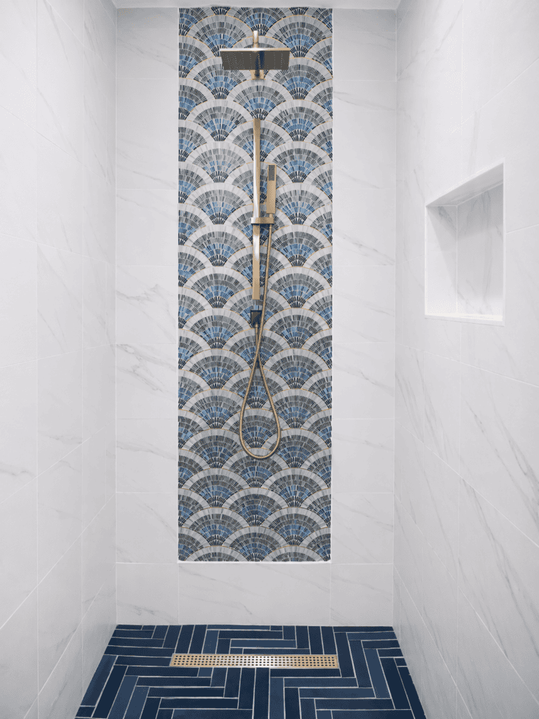Classic blue and white color combination for a bathroom shower but elevated. Stop designing for resale. Designed by Joy Maier, The Aspiring Home Interiors