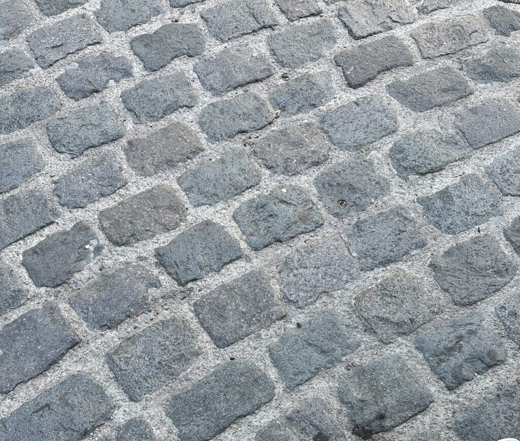 running bold pattern on cobblestone street