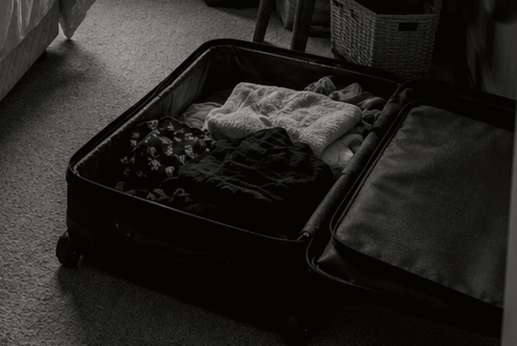 open suitcase on floor not company ready